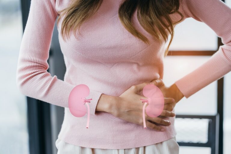 A woman suffering stress and touching her kidney on virtual kidney shape.