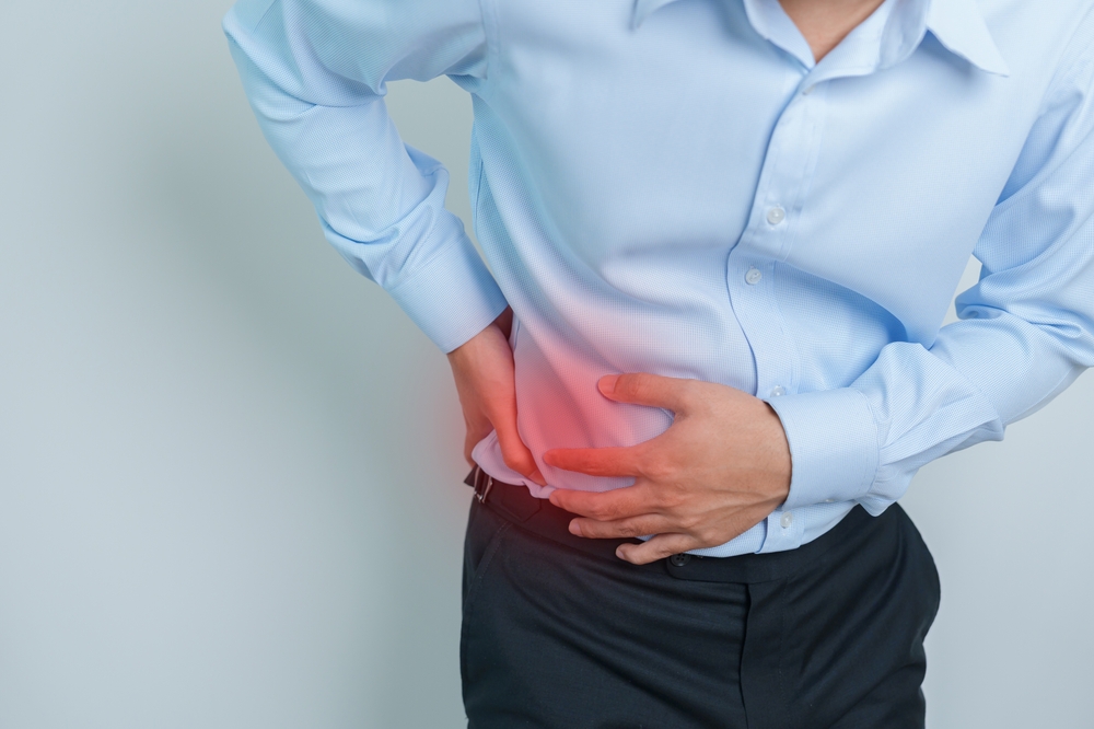 A man having back pain due to urinary system and stones cancer.